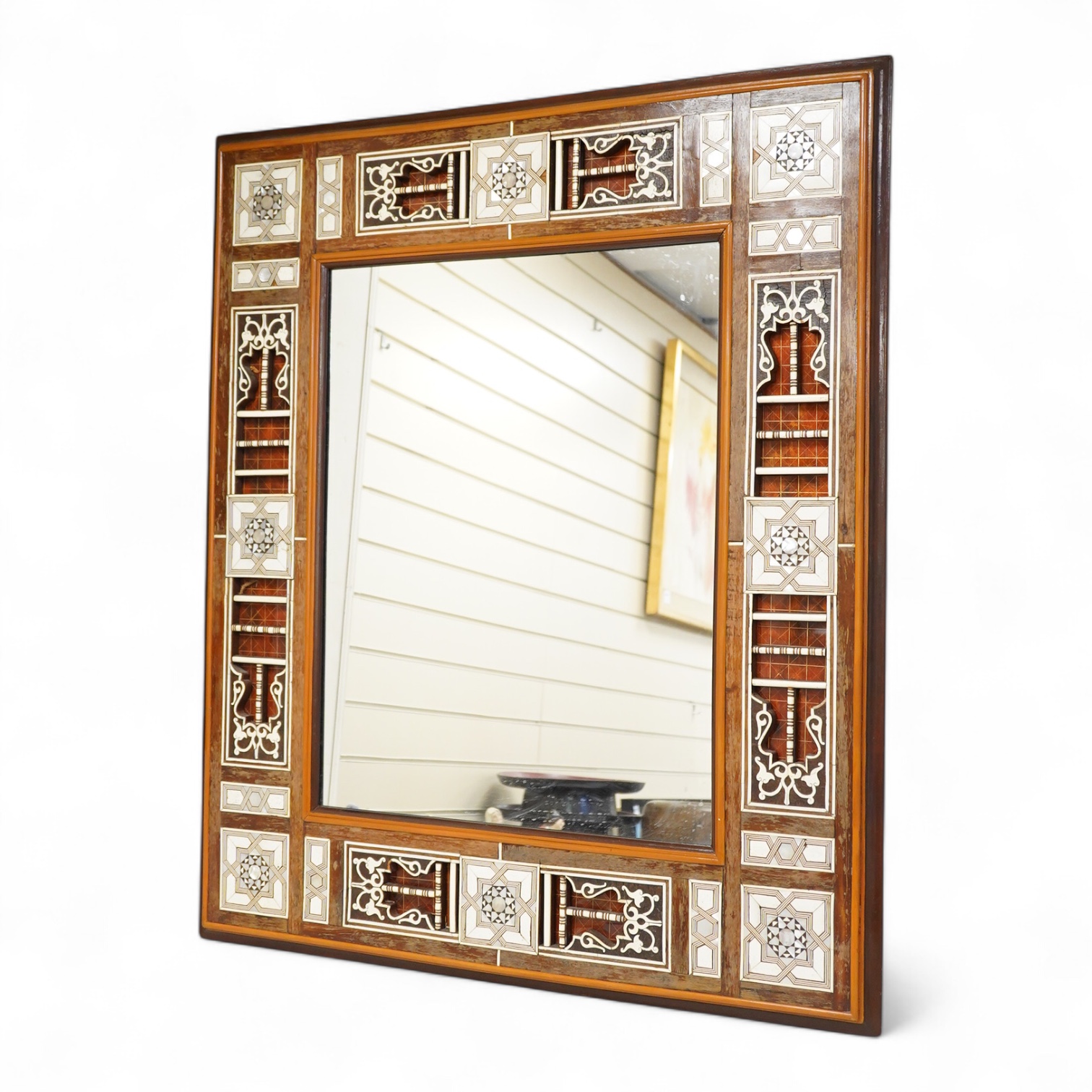 A Moroccan bone and abalone inlaid wall mirror